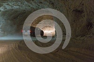 Cars driving into a tunnel from Slanic Prahova salt pan