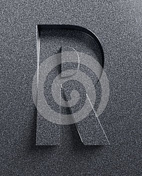 Slanted 3d font engraved and extruded from the surface, letter R