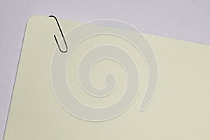Slanted  empty  paper note with paper clip