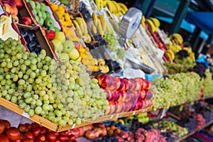 Slanted image of a shelf of fruit for sale