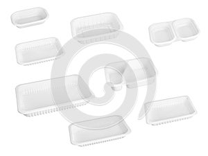 Slanted view different types of white trays isolated on white background - black plastic trays - trays food - rectanguler trays