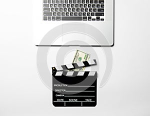 Slapstick, money and laptop photo