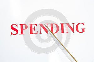 Slashing spending.