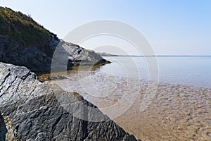 Slate cliffs on the shoreline of the River Dwyryd, Gwynedd, Wales