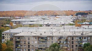 Slate, pipes and antennas on the roofs of the old five-story buildings. Block of flats. Sleeping urban areas