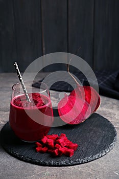 Slate plate with glass of beet smoothie