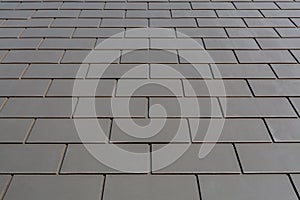 Slate roof against blue sky, Gray tile roof of construction house with blue sky and cloud background