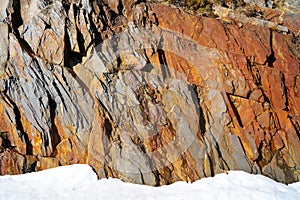 Slate stone texture and snow in Pyrenees Spain