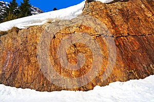 Slate stone texture and snow in Pyrenees Spain