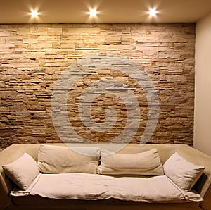 Slate stone wall with couch