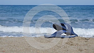 Slates lie on the sand on the beach