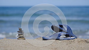 Slates lie on the sand on the beach