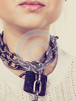 Woman having chain with padlock on neck