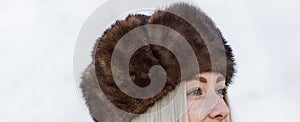 Fashionable trend. Woman in fur fat and faux fur coat photo