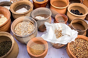 Slavic dry food products in an earthenware pots.