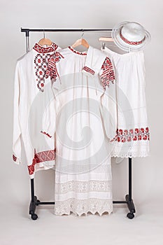 Slavic traditional clothing: women's and men's shirts, hat and apron
