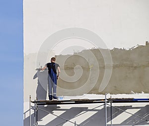 Plasterers Builders plastered wall in a commercial building. Wor