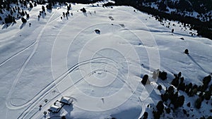 sled dog snow on dolomites aerial view val badia in winter season panorama landscape drone footage