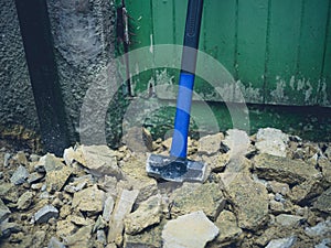 Sledge hammer and rubble