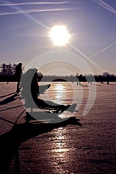 Sledging on a frozen lake in the Netherlands