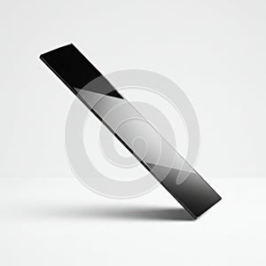Sleek black rectangular object with reflective surface isolated on white background