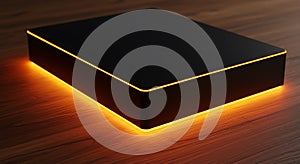 A sleek, black rectangular object with smooth, reflective surfaces is positioned on a