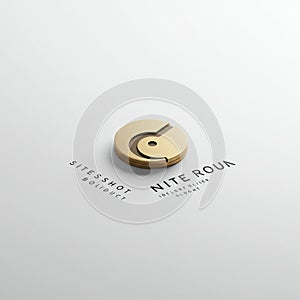 A sleek, circular 3D logo design, predominantly gold, featuring a cut-out section and a central hole