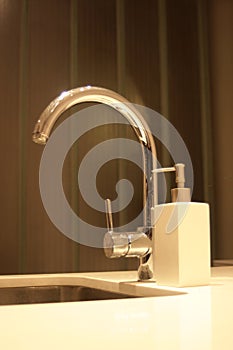 Sleek kitchen faucet. photo