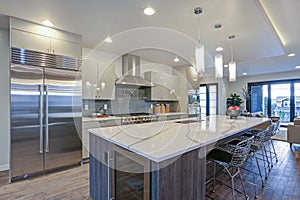 Sleek modern kitchen design with a gray center island