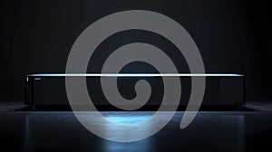 Sleek Rectangular Object Illuminated on Dark Surface