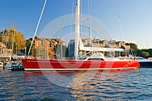 Sleek, red oceangoing sailboat photo