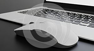 Foreground a white wireless computer mouse with a scroll wheel is