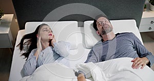 Sleep Apnea Snoring Disturbance. Angry Woman photo