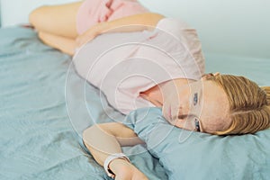 Sleep-deprived pregnant woman struggles with insomnia, navigating the challenges of restlessness during pregnancy photo