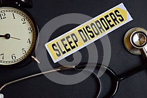 Sleep Disorders on the paper with Healthcare Concept Inspiration. alarm clock, Black stethoscope.