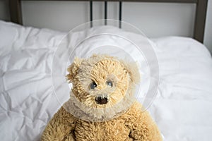 Sleep kids problems bear sit on bed closeup concept