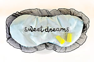 Sleep mask on white Sweet dreams ear plugs