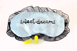 Sleep mask on white Sweet dreams ear plugs