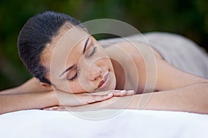 Sleep, massage and a woman on a spa bed for stress relief, luxury relaxation and wellbeing in nature. Relax, calm and a