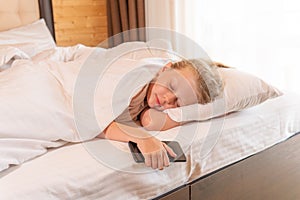 Sleep mobile phone girl beautiful young bed blanket sleeping morning, concept white relax in person for smile positive