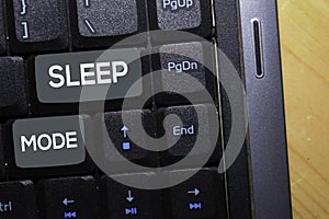 Sleep Mode write on keyboard isolated on laptop background