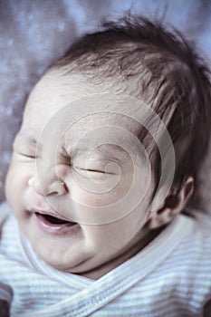 Sleep, new born baby curled up sleeping on a blanket, multiple e