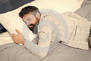 Sleep wake homeostasis keeps track of your need for sleep. Man sleep at home. During deep sleep human growth hormone photo