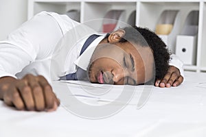 Sleeping African American clerk in office