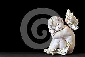 Sleeping angel figurine