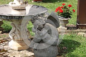 Sleeping angel figurine in the garden