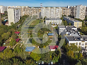 Sleeping area with residential buildings, football field and childrens playgrounds in Moscow, Russia