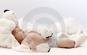 Sleeping baby with bear