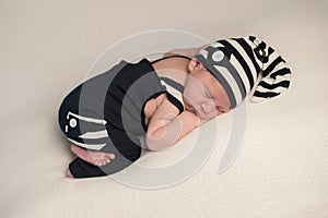 Sleeping Baby Boy in Romper & Hat