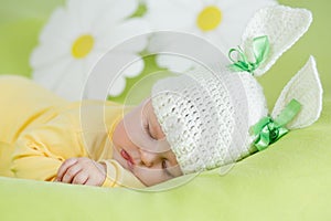 Sleeping baby in funny rabbit hat